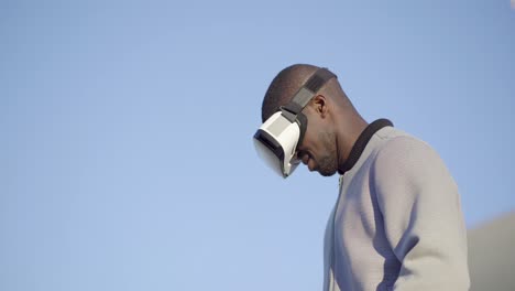 Man-in-virtual-reality-glasses-managing-new-reality-with-hands